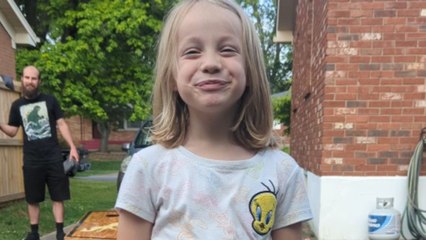 Little girl transforms a discarded tissue box into a regal 'Tis-Shoe'