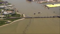 Barge collides with Texas bridge pouring oil into river