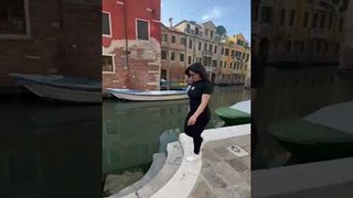 Woman Slips and Falls Into Canal While Shooting Video