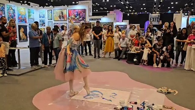 Russian ballerina crafts paintings with her feet while dancing