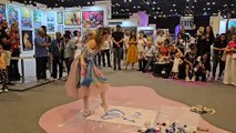 Russian ballerina crafts paintings with her feet while dancing