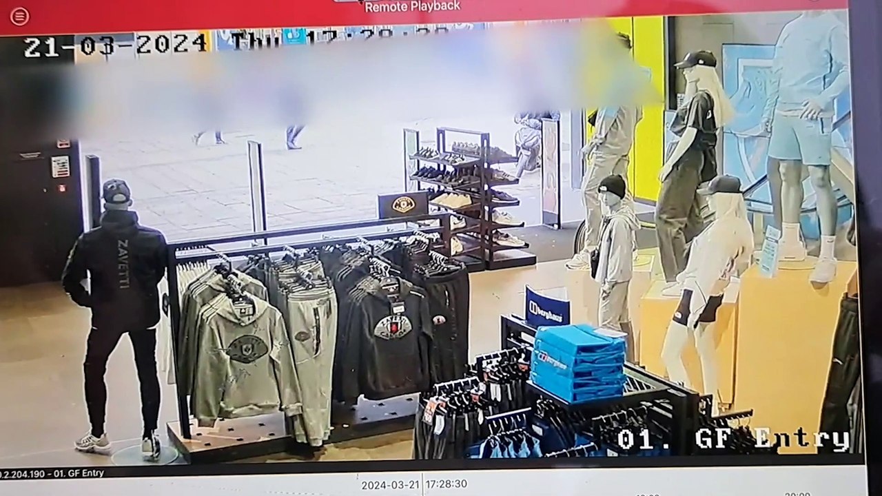 Yob rides moped inside sports shop
