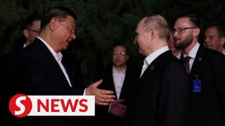 Putin and Xi embrace in Beijing to seal strategic partnership