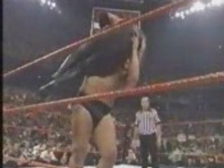 Big Show chokeslams Undertaker through ring