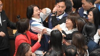 Taiwan parliament brawl escalates into night as lawmakers shove, tackle and hit each other