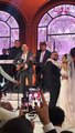 مصطفى قمر يعزف بالجيتار وإبنة سامح يسري ترقص على أنغامه في حفل زفافها