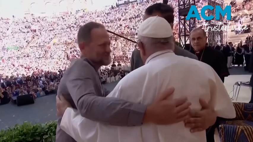 Pope Francis embraced an Israeli orphaned by Hamas and a Palestinian whose brother was killed by Israeli soldiers in a group hug calling for peace in the regions.