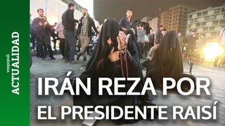 Los iraníes toman las calles para orar por el presidente Raisí