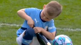Phil Foden’s five-year-old son spotted trying to open champagne bottle after Manchester City win Premier League