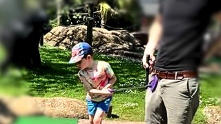 Toddler at crazy golf hits his dad straight between the legs