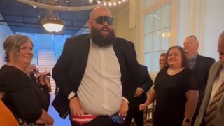 Groomsman puts on a show down the aisle!