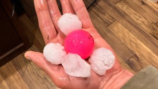 Video shows golf ball-sized hailstones raining down during storm