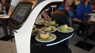Robot serves at French restaurant as staff shortages bite