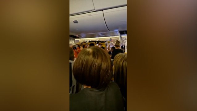 Passengers carried out on stretchers from Singapore Airlines flight after severe turbulence kills one