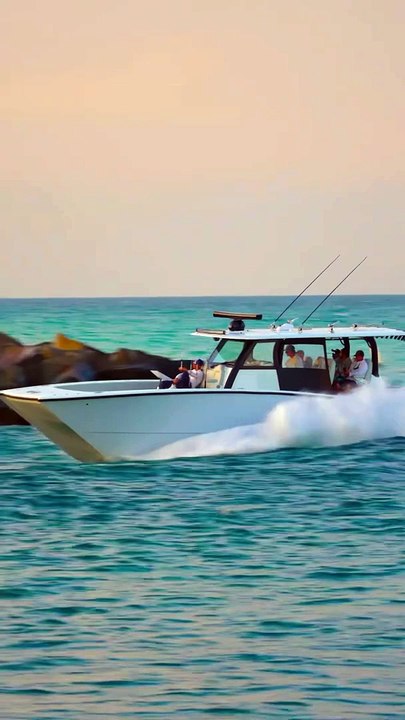 Freeman Catamaran goes right into the sunset at the Haulover Inlet in Miami, Florida