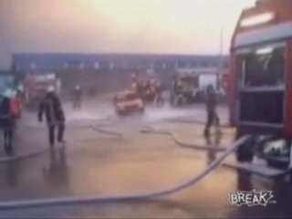 Firemen Lift Car With Hose Water