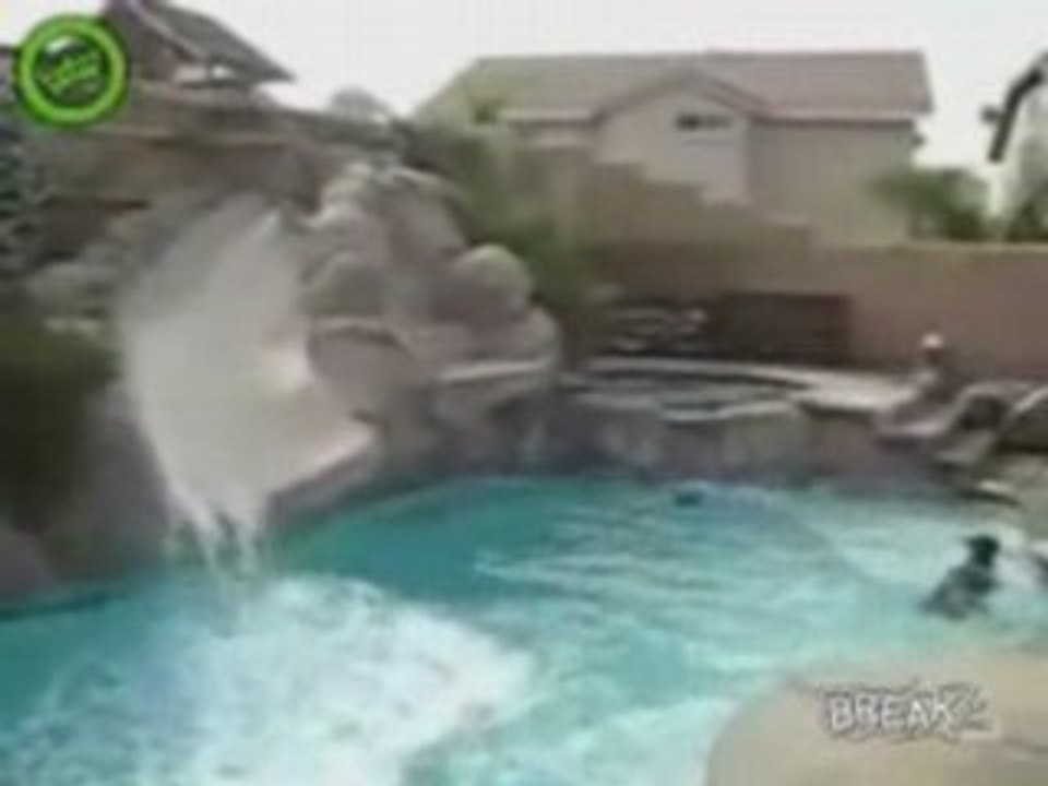 Doberman Likes Water Slide