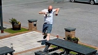 Hilarious moment man saves his pint from 'mini tornado' in pub beer garden
