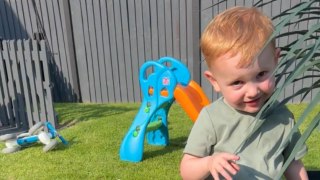 Grandpa's mock aggression makes the little boy laugh hard