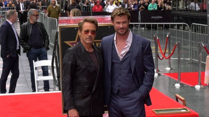 Chris Hemsworth at his Hollywood Walk of Fame star ceremony with Robert Downey Jr.