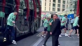 Leeds United fans welcome players off the bus at Wembley