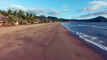 Dynamic drone Aerial Tour-on-a-sunny-beach 4k video