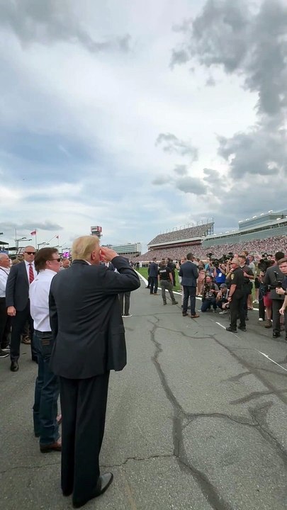 President Trump salutes the C-17 flyover at The Coca Cola 600 NASCAR in Concord, North Carolina.