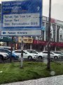 Car passes by fallen tree at AmBank in Taman Kinrara Puchong