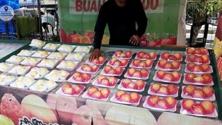 DELICIOUS AND FRESH FRUIT IS SOLD ON THE ROADSIDE
