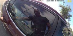 ドラマチックなビデオ：フロリダで警察官が車の窓ガラスを割って少女を救出
