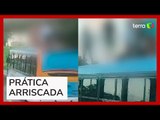 Jovens são flagrados 'surfando' em cima de ônibus em movimento no Recife