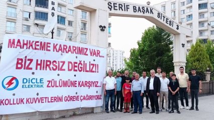 “Biz Hırsız Değiliz” pankartı asan siteye kaçak elektrik baskını