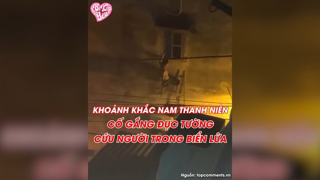 Nam thanh niên 1 tay đu cửa, 1 tay cầm búa cố đục tường cứu người trong biển lửa