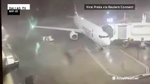 Parked airplane blown away by storm winds at Dallas airport