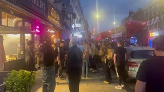 Crowd gathers outside London restaurant as three adults and child injured in shooting