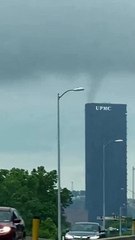 Funnel cloud forms above US Steel Tower.