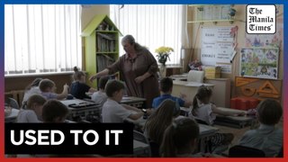 Exhausting school year of bombs, alerts ends in Ukraine