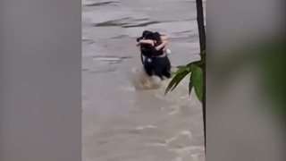 Italy floods: Heartbreaking footage of three friends hugging before being swept away