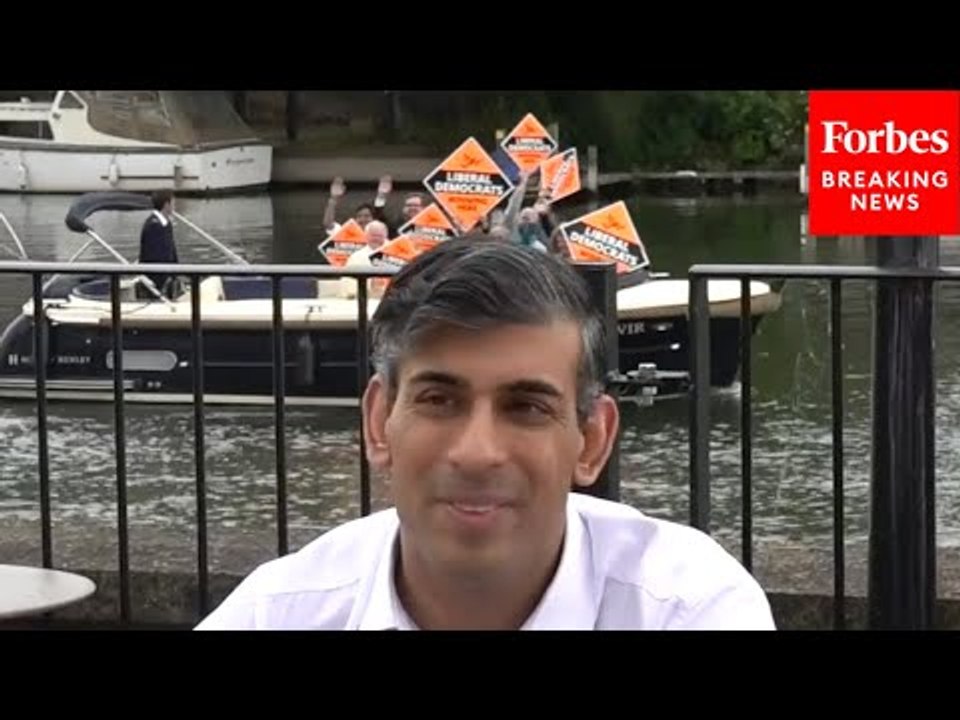 WATCH: UK Prime Minister Rishi Sunak Photobombed By Liberal Democrats During Campaign Event