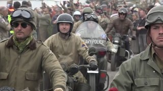 Vintage US Army Harley Davidson motorbikes take part in parade near D-Day beaches
