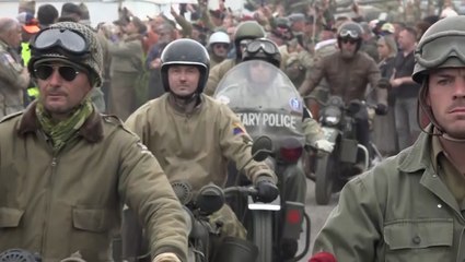 Vintage US Army Harley Davidson motorbikes take part in parade near D-Day beaches