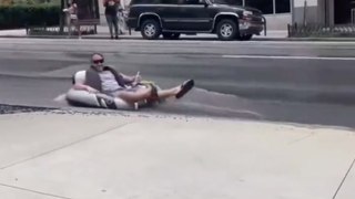 Atlanta resident floats down flooded street as city enters day five of water main breaks