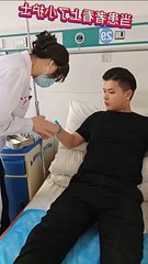 boy making heart symbol