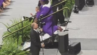 Man Trips and Falls Down Steps During Graduation Ceremony