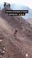 Rider Climbs Slippery Hill With Motorcycle