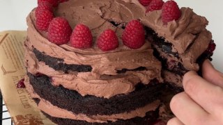 Dessert lover's heavenly chocolate cake offers a perfect blend of wild berries jam & chocolate frosting