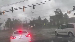 Cars drive through funnel cloud as tornado whips up debris in Maryland