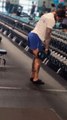 Dog Holds Owner's Phone During Workout at Gym