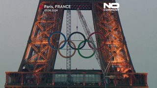 The Olympic rings go up on the Eiffel Tower