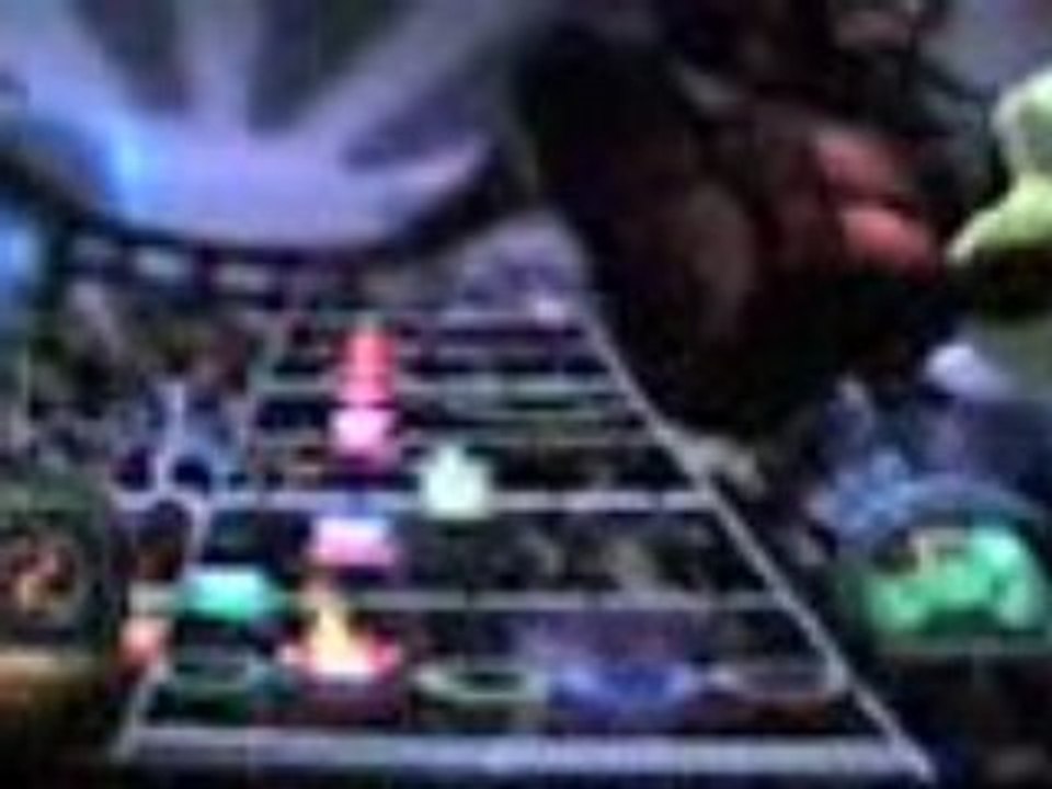 Mon ami à guitare hero III en expert.